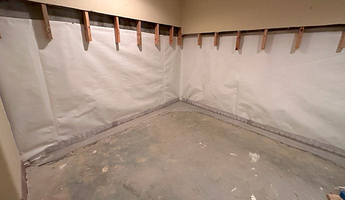 Basement waterproofing system installed