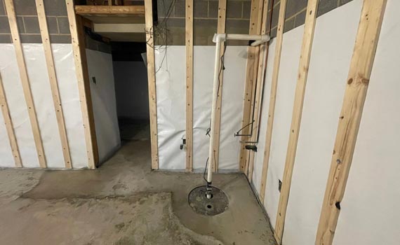 a basement with an installed sump pump