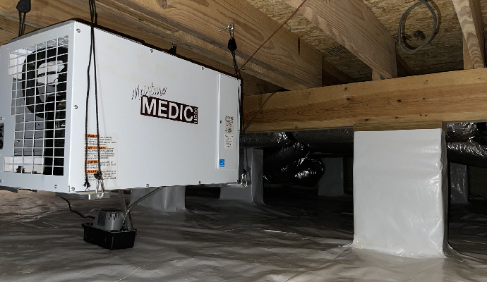 Installed dehumidification system in the crawl space