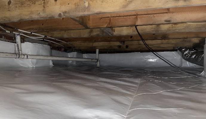 Crawlspace Encapsulation Process Showing Vapor Barrier Installation and Moisture Control System