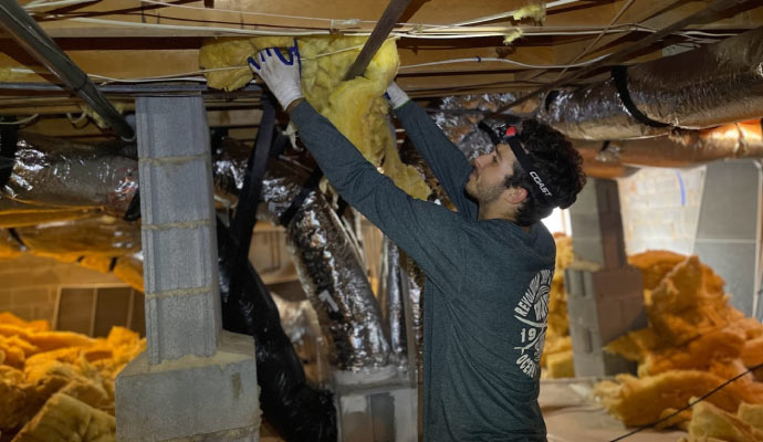 DryWorx service team member repairing crawl space