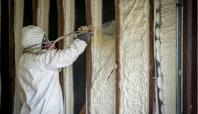 Insulating using spray foam