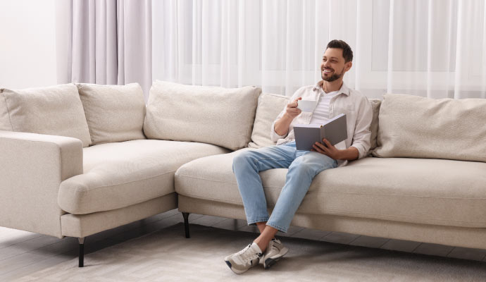 a healthy and happy person relaxing on sofa