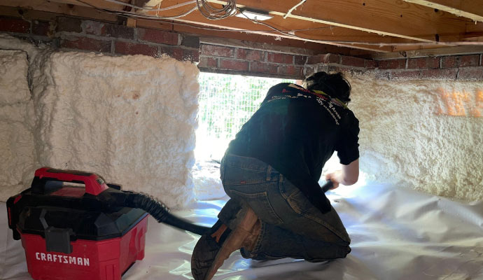 a professional technician maintaining vapor barrier