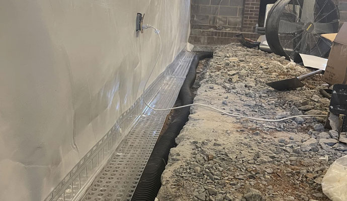 Interior basement drainage system