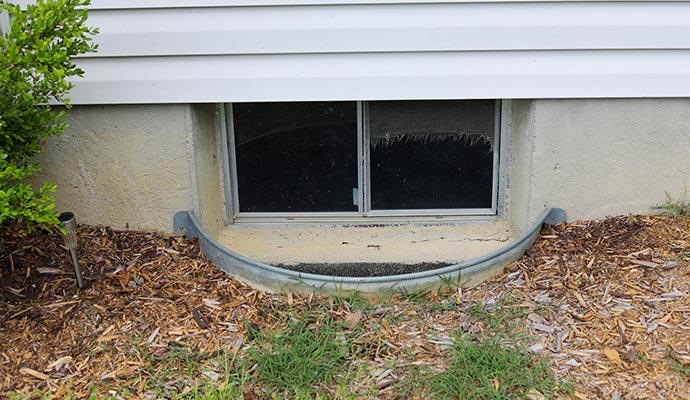 Waterproofed basement window