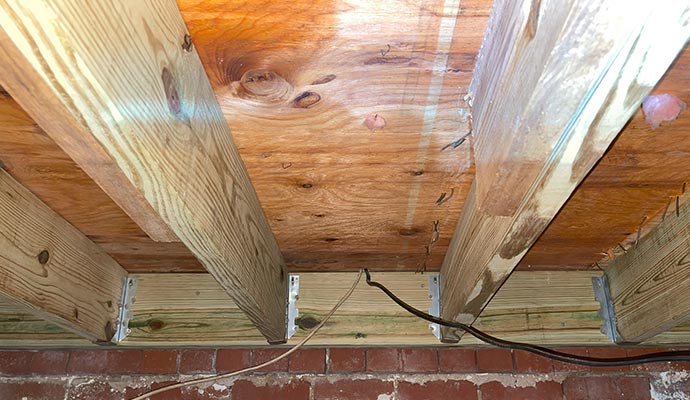Wooden floor structure with joists.